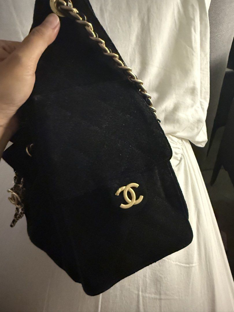 Chanel Black Suede Chain Bucket Bag small size (Category: Announcements) located in Taguig. Submitted by decentfinds18 (Listing ID 1460976027, Image 3). Description: - Black suede bucket bag - Gold chain straps - Iconic Chanel CC logo charm - Interior drawstring closure - Minor signs of wear on suede and hardware - Versatile for everyday or special occasions.