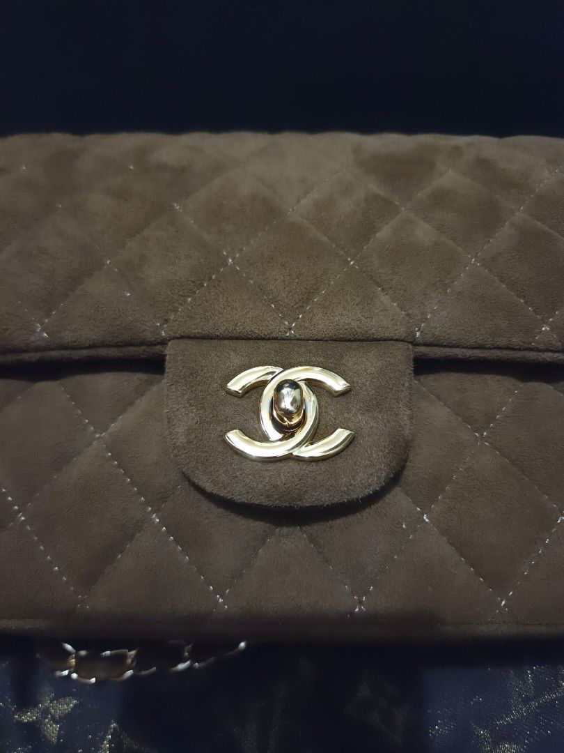 Chanel Suede Flap Bag (Category: Luxury Bags & Wallets) located in Pasig City. Submitted by sashasarisarishoppe (Listing ID 1460972322, Image 3). Description: - Japan Surplus brown suede Chanel flap bag - Classic quilted design - Gold chain strap - Iconic CC turn-lock closure - Multiple interior compartments - Versatile for day or night use - Really pretty in person.