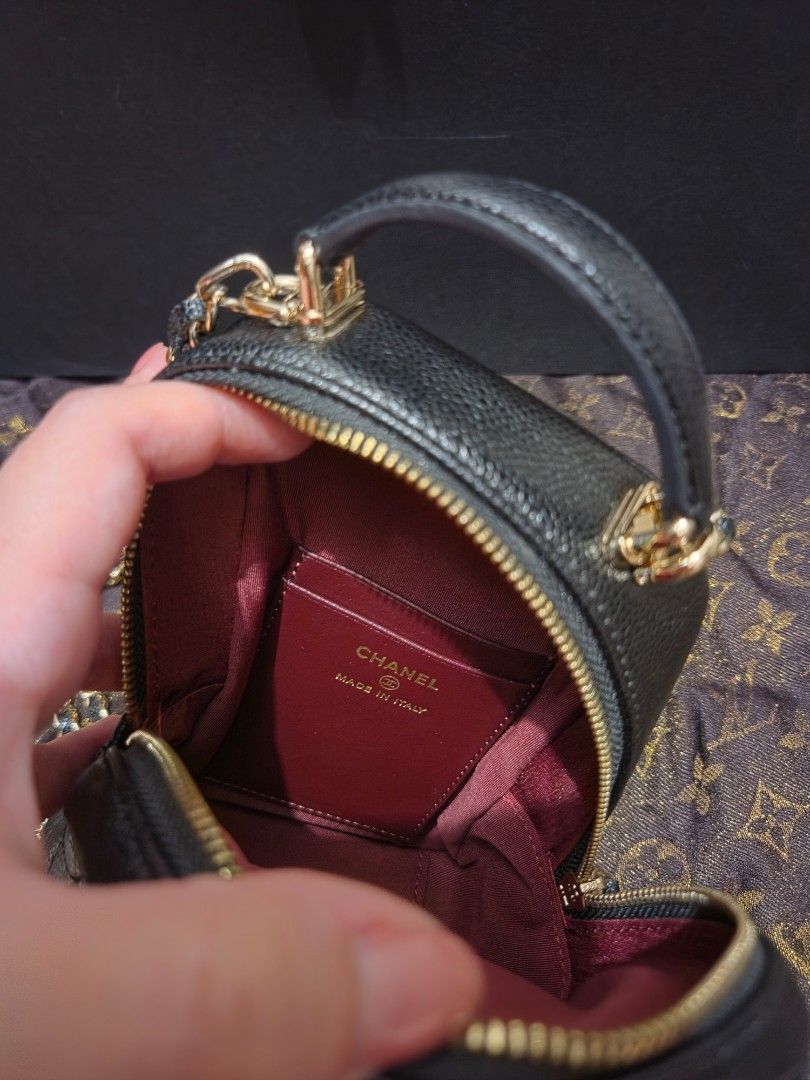 Chanel Vanity Case Bag with Card Holder (Category: Luxury Bags & Wallets) located in Pasig City. Submitted by sashasarisarishoppe (Listing ID 1460973121, Image 3). Description: - Japan Surplus Chanel black caviar leather vanity case - Includes matching card holder - Elegant gold hardware details - Secure zipper closure for main compartment - Luxurious burgundy fabric interior lining - Expertly crafted in Italy - Ideal size for carrying your daily