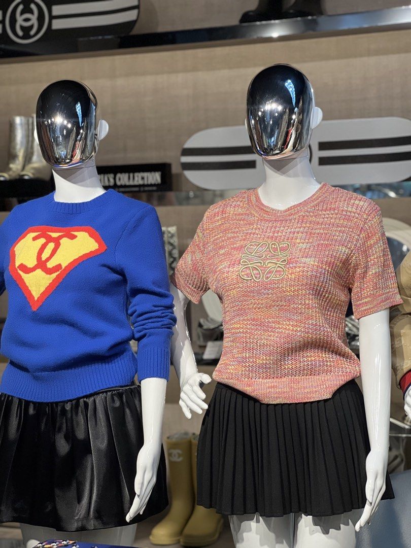 Chanel x Superman Blue Knit Sweater (Category: Luxury Apparel) located in Quezon City. Submitted by marias8230 (Listing ID 1461008038, Image 1). Description: - Stylish blue knit sweater - Features iconic Chanel logo reimagined as Superman's emblem - Long sleeves and classic crew neck - Versatile: pairs well with skirts or trousers - A standout piece for any fashion-forward individual.