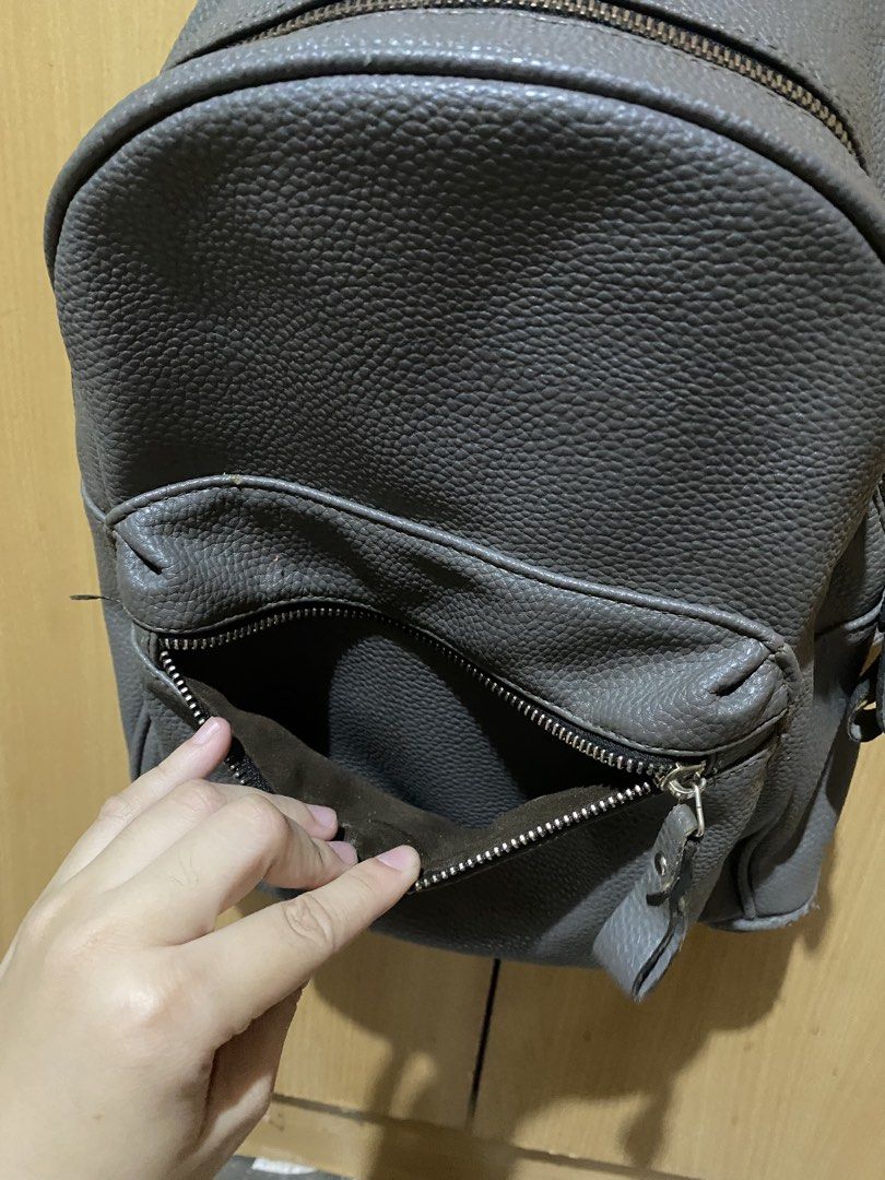 Charcoal Grey Pebbled Leather Mini Backpack | Casual Everyday Daypack (Category: Backpacks) located in Bulacan. Submitted by pennygirl_11 (Listing ID 1461037848, Image 3). Description: Bought this from SM Dept store! Color: Charcoal Grey / Slate Grey Details & Features: Textured pebbled faux leather finish with adjustable shoulder straps and top grab handle Main compartment features dual smooth zippers and lined interior pockets Compact, everyday