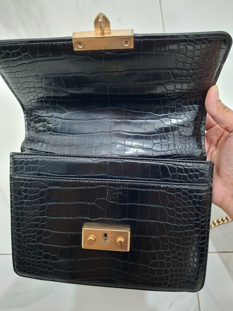 Charles & Keith Alva Croc-Effect Chain Strap Crossbody Bag (Category: Cross-body Bags) located in Quezon City. Submitted by clairy_fairy (Listing ID 1460979912, Image 2). Description: Pre-loved and in good condition, with visible signs of usage such as minor scratches and marks. Still functional and stylish. Please see photos for the actual condition..