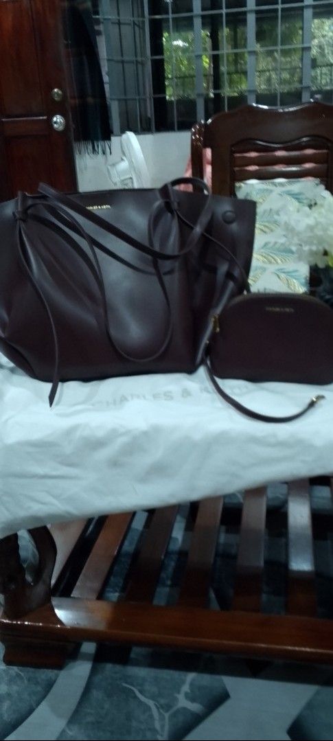 Charles & Keith Brown Tote Bag with Pouch (Category: Tote Bags) located in Caloocan City. Submitted by nobleflower_4c42cc (Listing ID 1459785621, Image 2). Description: - Brand: Charles & Keith - Color: espresso Brown - Style: Slouchy, relaxed tote bag - Features: Comes with a matching inner pouch - Straps: Long, comfortable for shoulder wear - Ideal for: Everyday use, carrying essentials one time used only almost brand-new bought in Singapore.