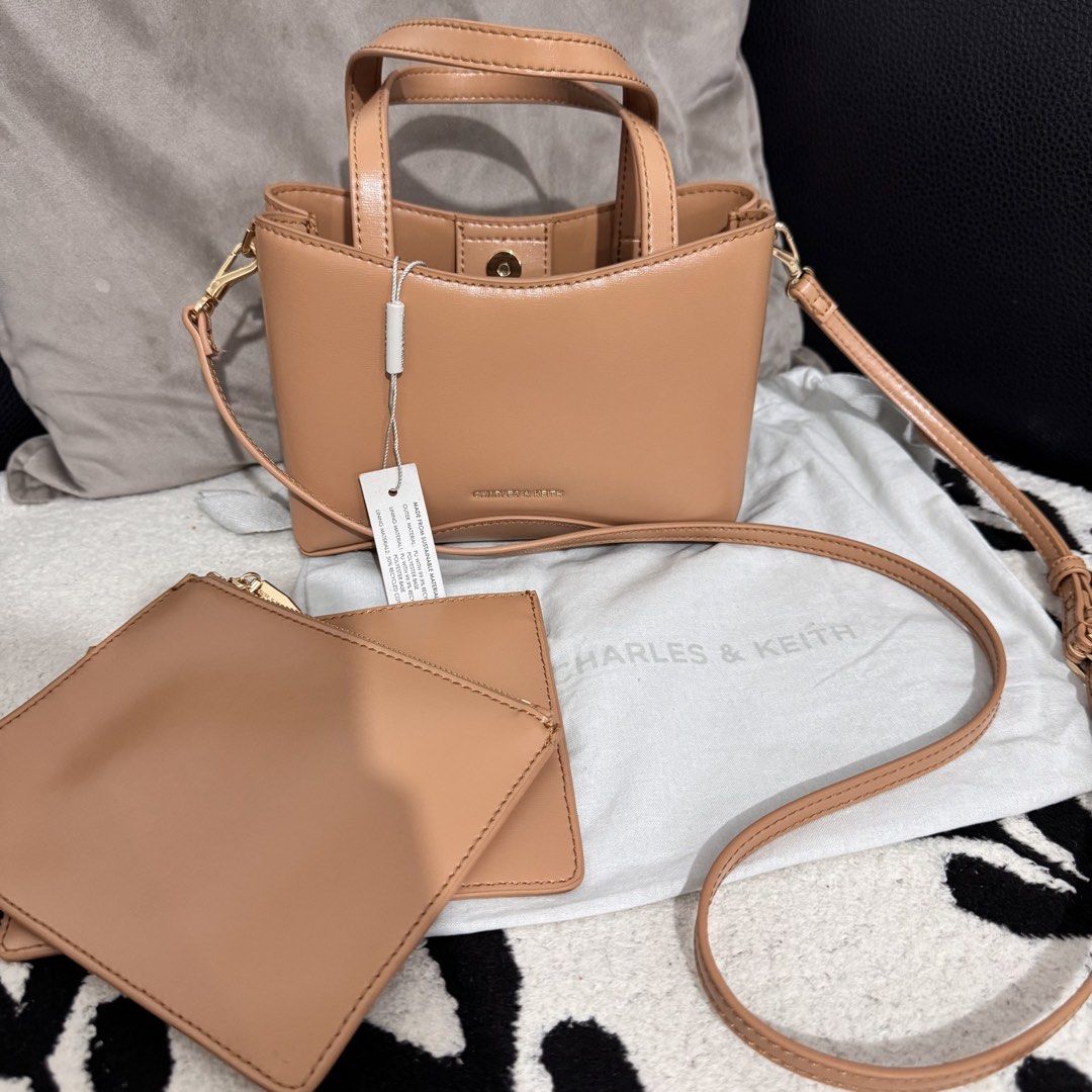 Charles N Keith Mini Sybill Bag (Category: Cross-body Bags) located in Bulacan. Submitted by tataseret (Listing ID 1461060588, Image 3). Description: Authentic CNK bag. Bought this in CNK Trinoma. With dust. Used only twice. Can pass as new. No dents and no scratches. Rfs: not a fan of small bags kaya nakatago lang Price slightly nego. Loc: North Caloocan.
