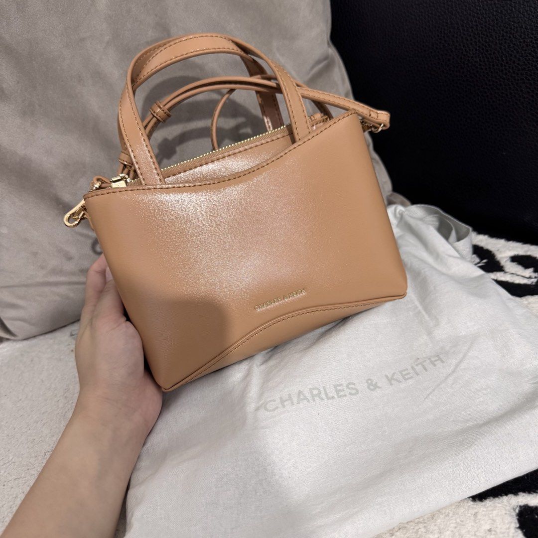 Charles N Keith Mini Sybill Bag (Category: Cross-body Bags) located in Bulacan. Submitted by tataseret (Listing ID 1461060588, Image 2). Description: Authentic CNK bag. Bought this in CNK Trinoma. With dust. Used only twice. Can pass as new. No dents and no scratches. Rfs: not a fan of small bags kaya nakatago lang Price slightly nego. Loc: North Caloocan.