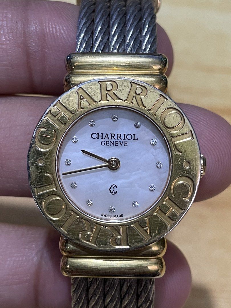 Charriol Geneve St. Tropez Quartz (Category: Women's Watches) located in Taguig. Submitted by tester1x (Listing ID 1460938393, Image 2). Description: Charriol Geneve St. Tropez Swiss Made Quartz 028/2 G02412 Mother of pearl dial w/ diamonds Gold plated engraved bezel Stainless steel backcase Twisted cable bracelet 24.5mm Fit in small wrist size.