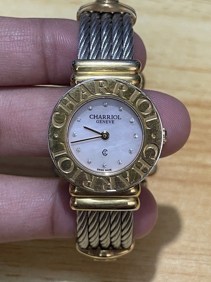 Charriol Geneve St. Tropez Quartz (Category: Women's Watches) located in Taguig. Submitted by tester1x (Listing ID 1460938393, Image 1). Description: Charriol Geneve St. Tropez Swiss Made Quartz 028/2 G02412 Mother of pearl dial w/ diamonds Gold plated engraved bezel Stainless steel backcase Twisted cable bracelet 24.5mm Fit in small wrist size.