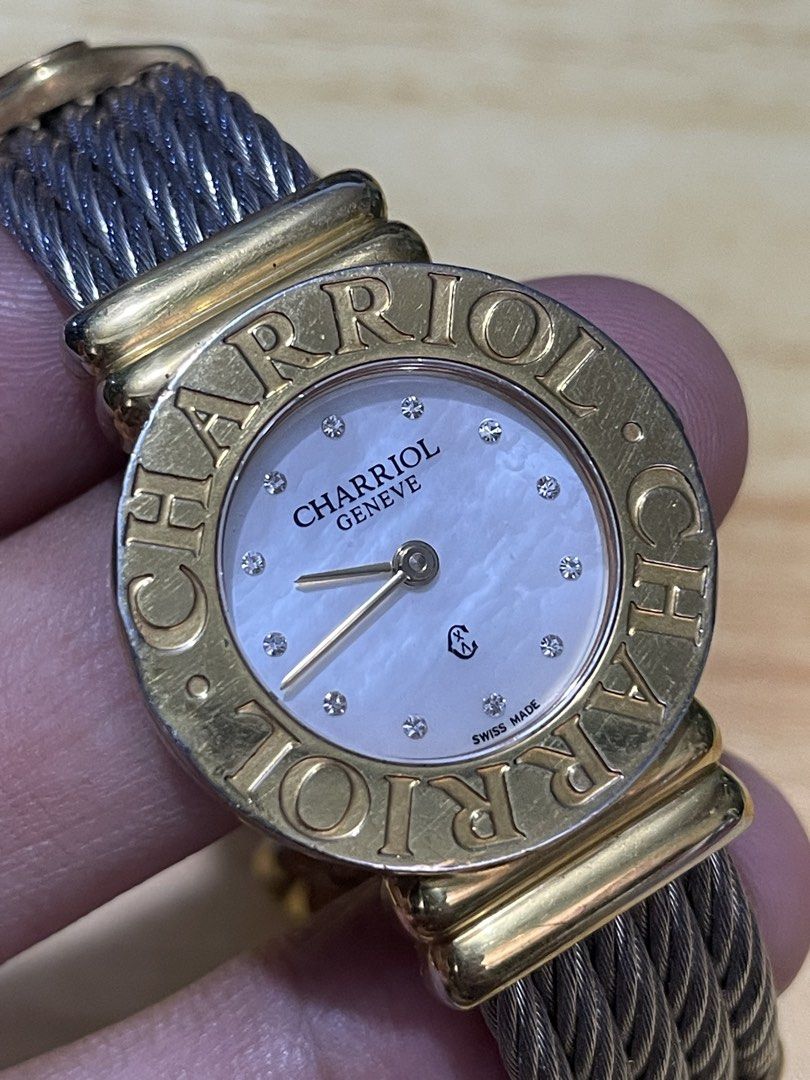 Charriol Geneve St. Tropez Quartz (Category: Women's Watches) located in Taguig. Submitted by tester1x (Listing ID 1460938393, Image 3). Description: Charriol Geneve St. Tropez Swiss Made Quartz 028/2 G02412 Mother of pearl dial w/ diamonds Gold plated engraved bezel Stainless steel backcase Twisted cable bracelet 24.5mm Fit in small wrist size.
