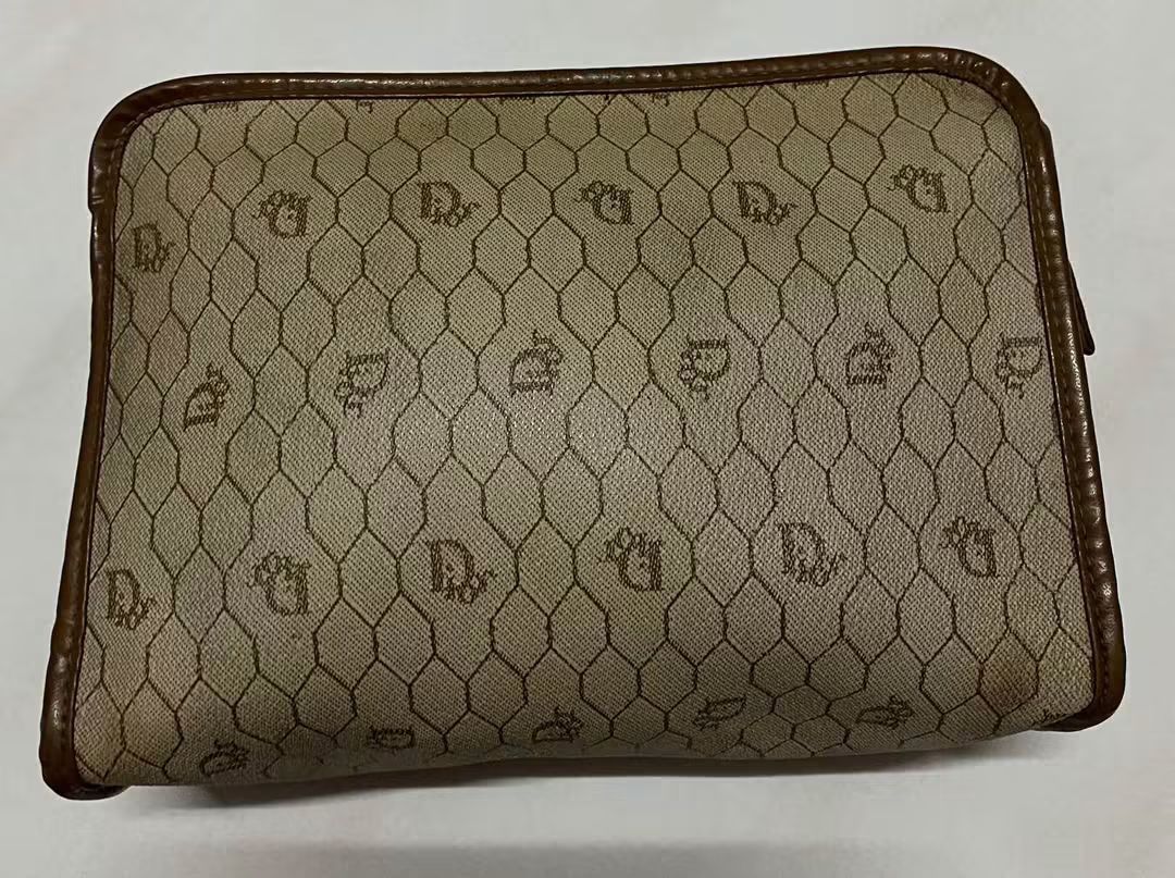 Christian Dior Monogram Pouch (Category: Luxury Bags & Wallets) located in Manila. Submitted by gutierrez23265 (Listing ID 1461074118, Image 1). Description: - Vintage Christian Dior pouch - Classic Diorissimo monogram pattern - Brown leather trim and zipper - Ideal for organizing essentials - Shows some signs of wear consistent with age - A timeless addition to any collection pls check all photos details before magmine no return nonexchange paym