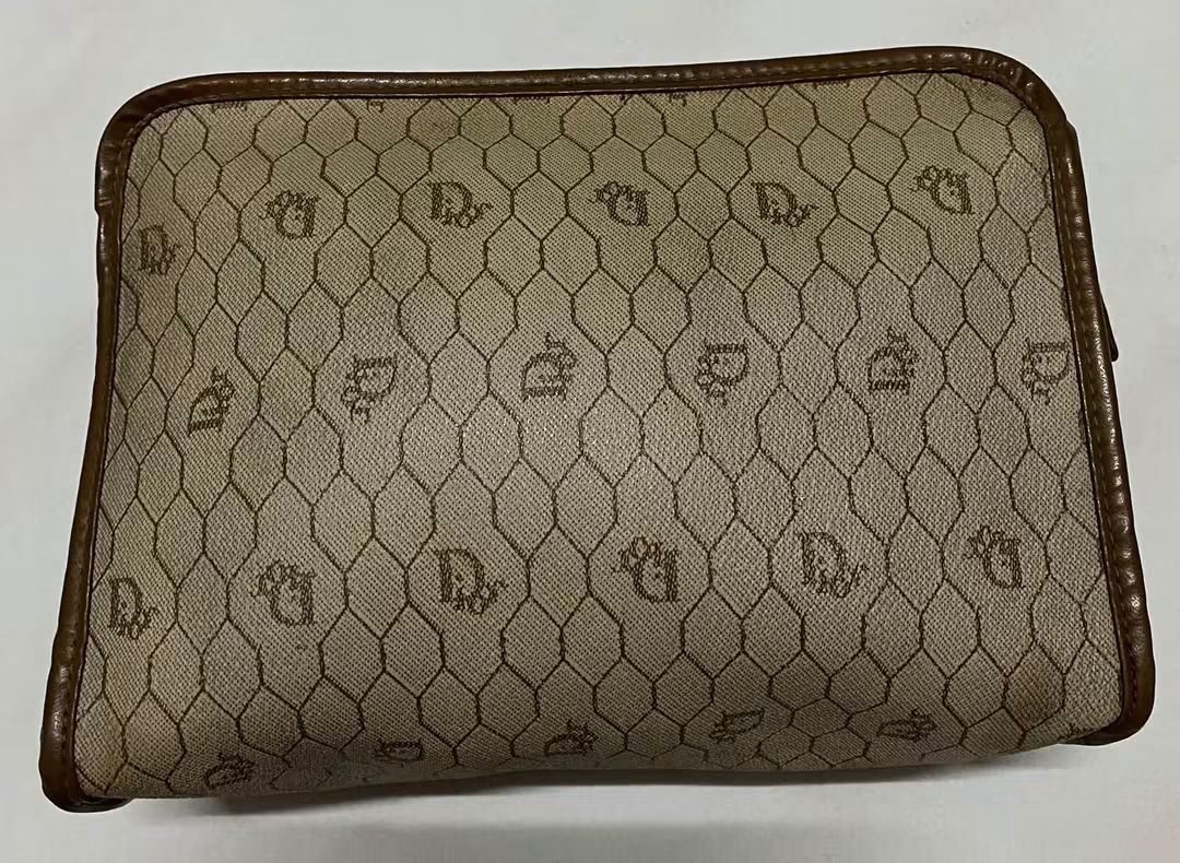 Christian Dior Monogram Pouch (Category: Luxury Bags & Wallets) located in Manila. Submitted by gutierrez23265 (Listing ID 1461074118, Image 2). Description: - Vintage Christian Dior pouch - Classic Diorissimo monogram pattern - Brown leather trim and zipper - Ideal for organizing essentials - Shows some signs of wear consistent with age - A timeless addition to any collection pls check all photos details before magmine no return nonexchange paym