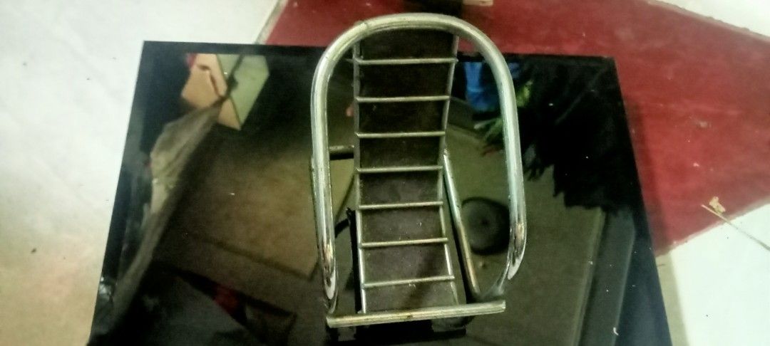Chrome cellphone chair (Category: Tables & Sets) located in Paranaque City. Submitted by dimaguilaa94969 (Listing ID 1460959133, Image 1). Description: - Sleek chrome and black tiered desk organizer - Tiered step design for easy access - Ideal for holding small desk items - Promotes a tidy and organized workspace - Suitable for both office and home use pm if int - Dimensions: Approx. X inches tall, Y inches wide09260966619 .