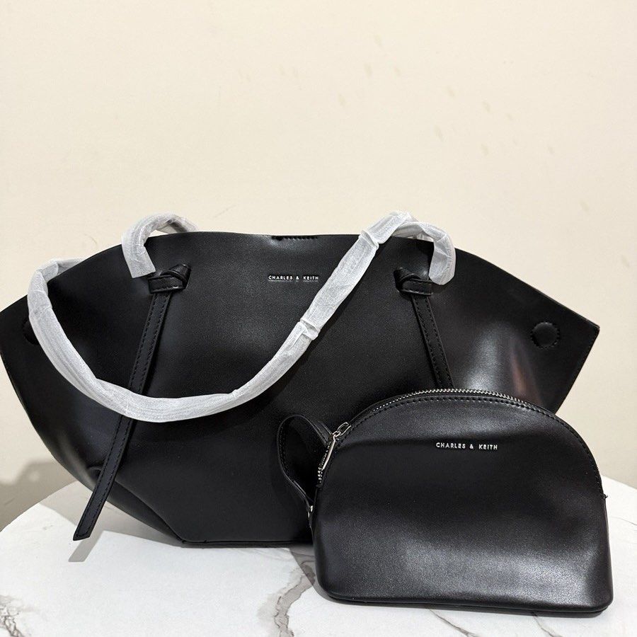 C&K Calla tote (Category: Tote Bags) located in Bulacan. Submitted by mykakarizza (Listing ID 1461108187, Image 1). Description: CALLA RESTOCK✨✨ ₱950 onlyy C&K Calla tote Strap drop length 31 cm Strap length 66 cm Width 18-40 cm Depth 10 cm Height 23 cm Add paperbag 100 📸 Actual pics! 🙋🏻‍♀️ ─── ✦ ─── ✦ ─── ✦ ─── ✦ ─── 🛍️ LOOKING FOR MORE RESELLERS 🛍️ ✨ Buy 3 pcs of ANY items — FREE SHIPPING NA!🚚 ✨ Buy 10 items → FREE SF + ₱50 OFF EACH! 💖 P