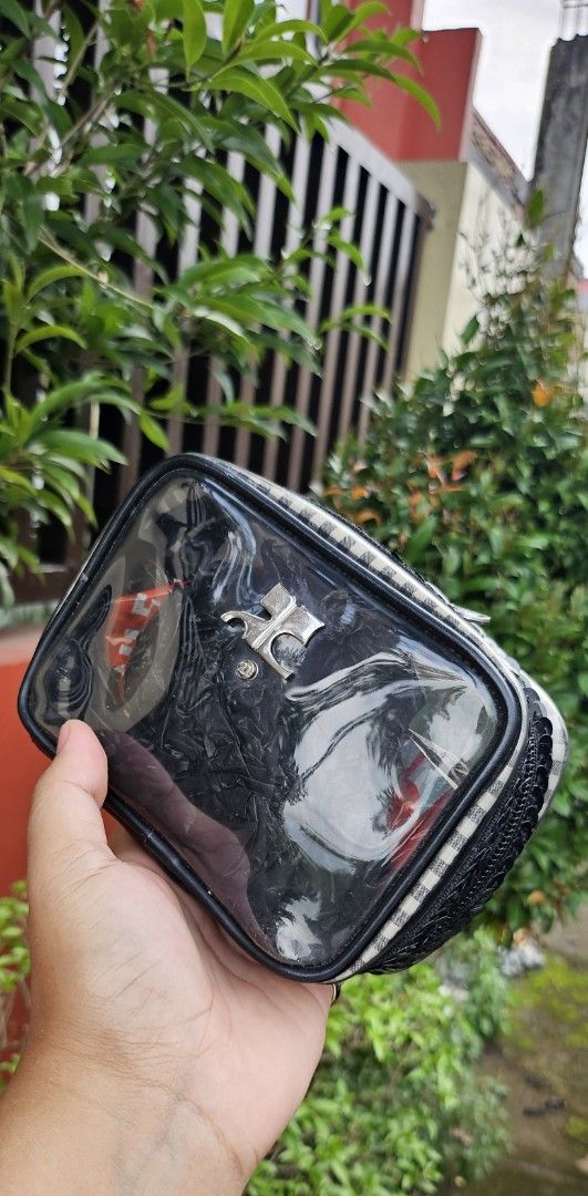 Clear Cosmetic Bag with Plaid and Sequins (Category: Purses & Pouches) located in Cavite. Submitted by sunghanphil_31 (Listing ID 1461087791, Image 1). Description: - Cute clear cosmetic bag - Black and white plaid pattern on sides - Black sequins detailing around the zipper - Zipper closure for secure storage - Features a small metal emblem on the front - Ideal for organizing makeup, toiletries, or other small essentials.
