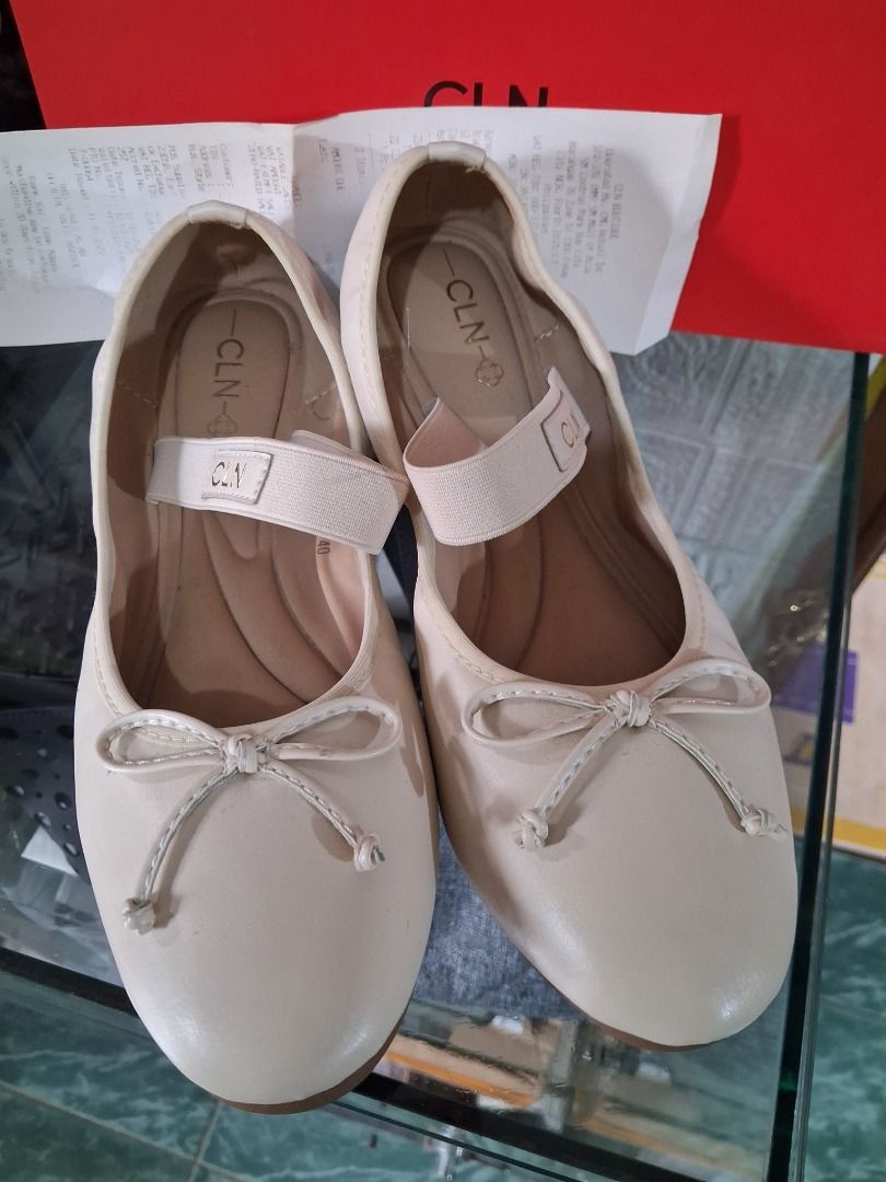 CLN Beige Ballet Flats with Bow and Strap (Category: Flats & Sandals) located in Manila. Submitted by katkween23 (Listing ID 1460961227, Image 2). Description: - Brand: CLN - Color: Beige - Style: Ballet Flats - Features: Cute bow detail at the front, elastic strap for a secure fit - Includes: Original box and receipt - Ideal for: Everyday wear.