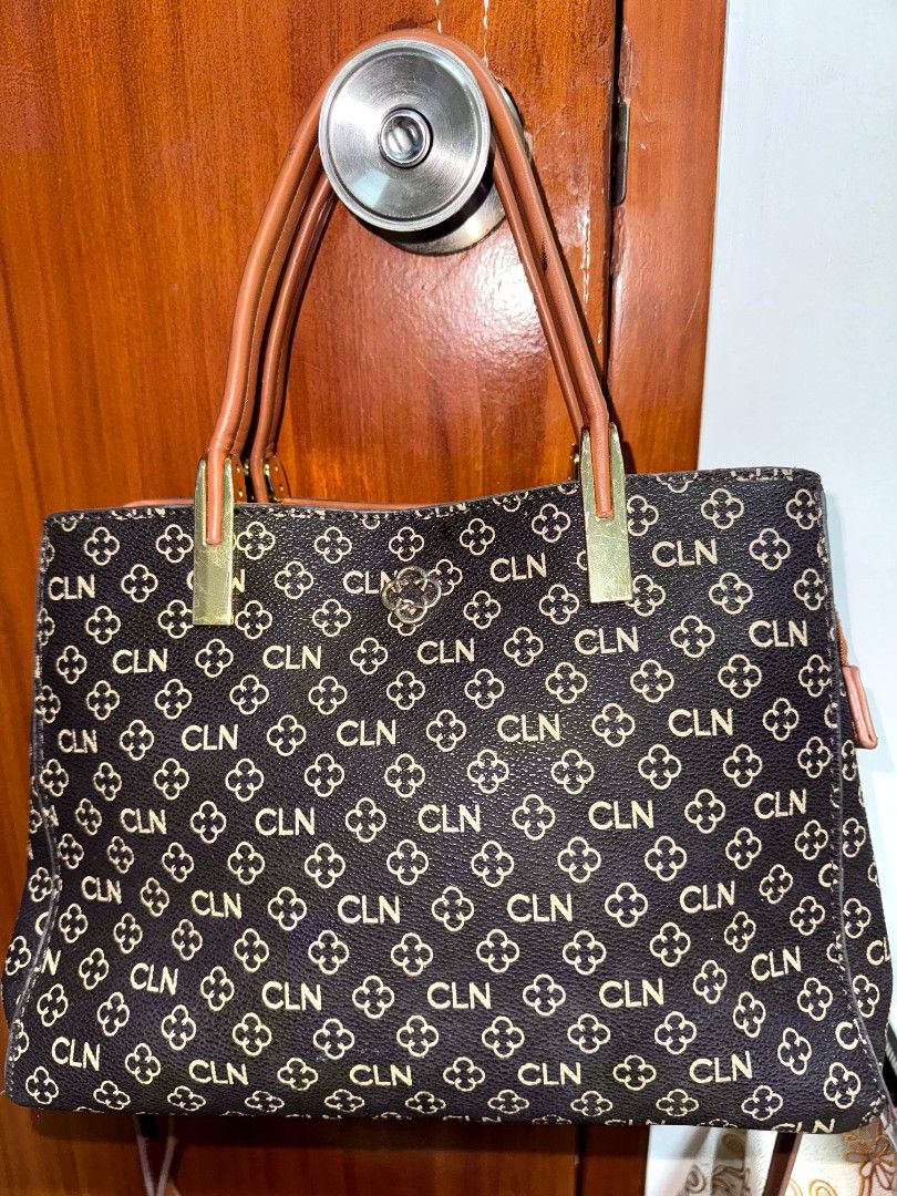 CLN Monogrammed Handbag with Brown Straps (Category: Luxury Bags & Wallets) located in Caloocan City. Submitted by mylove326 (Listing ID 1461085124, Image 1). Description: - Chic brown handbag with iconic CLN monogram pattern. - Secure zip closure to keep your belongings safe. - Multiple interior compartments for organized storage. - Comfortable brown leather-like straps. - Elegant gold hardware details. - Ideal for your everyday adventures..