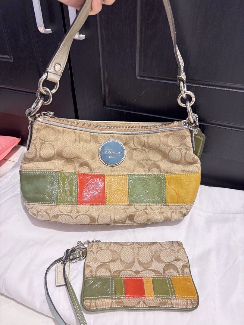 Coach Canvas Patchwork bag & Wallet Set (Category: Shoulder Bags) located in Lapu Lapu. Submitted by affordmo (Listing ID 1461048811, Image 1). Description: - Authentic Coach handbag and matching wallet set. - Beige signature monogram canvas with colorful leather patchwork. - Silver hardware and chain strap. - Zipper closure on the handbag. - Small wristlet wallet included. - Perfect for everyday use. - Shows some signs of wear, but plenty of lif