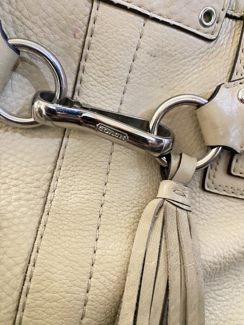 Coach Hampton Cream Leather Carry all Bag (Category: Luxury Bags & Wallets) located in Abulug. Submitted by vaffiqvri (Listing ID 1461019946, Image 3). Description: - Cream leather Coach tote bag - Features a tassel detail - Charms not included - Zipper closure for the main compartment (detachable 😻🫶🏻) - Shows some signs of wear on leather and handles - Ideal for everyday use - Price still negotiable .