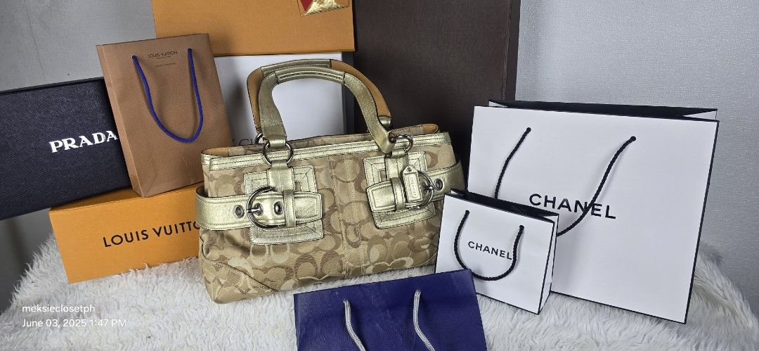 Coach Monogram Canvas & Leather Trim Handbag (Category: Luxury Bags & Wallets) located in Pasig City. Submitted by dertah (Listing ID 1461038387, Image 1). Description: - Authentic Coach monogram canvas handbag - Elegant gold leather trim - Stylish buckle details - Dual top handles for comfortable carrying - Comes with original dust bag - Perfect for everyday use - A timeless addition to your collection.