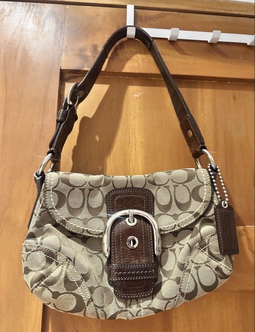 Authentic Coach Soho Signature Bag (Category: Luxury Bags & Wallets) located in Manila. Submitted by happymelona (Listing ID 1461109558, Image 1). Description: - No lowballing Would rather keep than sell for lower -authentic! -super pretty in person - still in good condition - very hard to let goo!! mop gcash Mod lalamove or j&t.