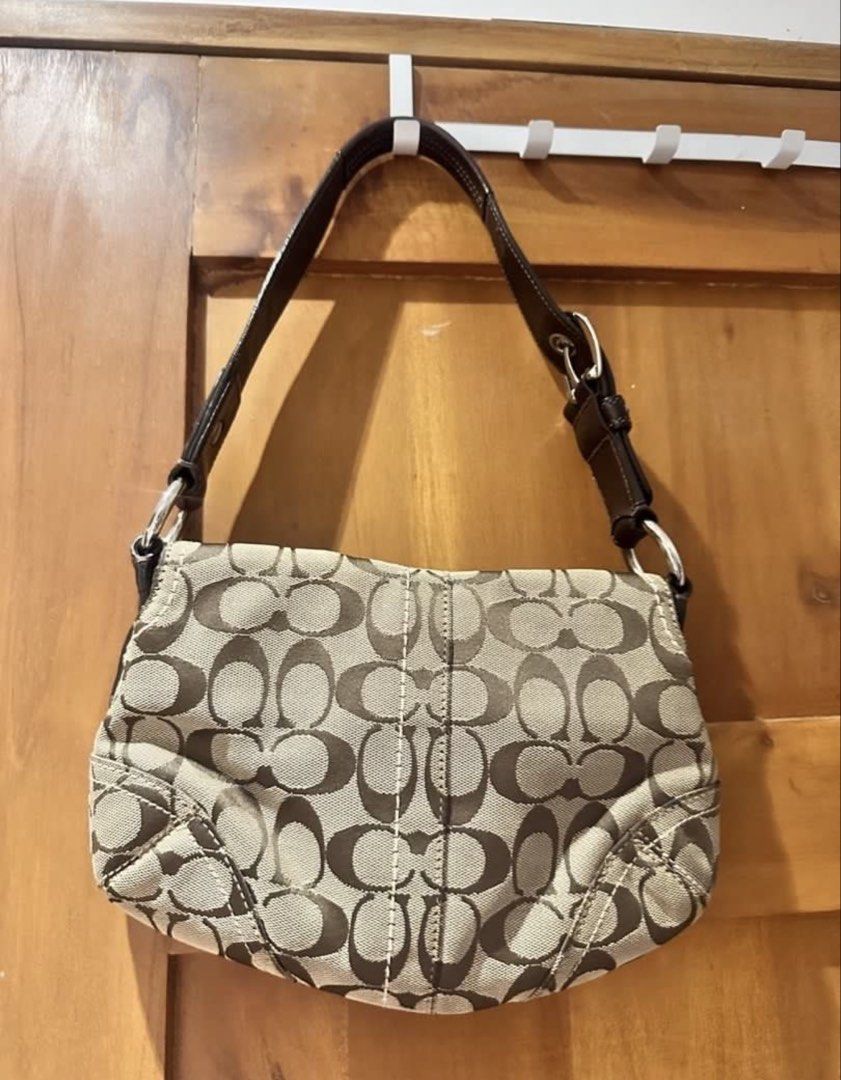 Authentic Coach Soho Signature Bag (Category: Luxury Bags & Wallets) located in Manila. Submitted by happymelona (Listing ID 1461109558, Image 2). Description: - No lowballing Would rather keep than sell for lower -authentic! -super pretty in person - still in good condition - very hard to let goo!! mop gcash Mod lalamove or j&t.