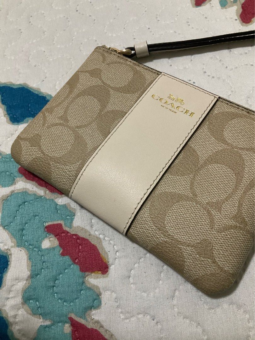 Coach Wristlet- Light Khaki/ Chalk (Category: Wallets & Card holders) located in Marikina City. Submitted by triacarlos (Listing ID 1461057789, Image 3). Description: Authentic coach wristlet 😊 Good as new! See pics for the condition (with a very unnoticeable stain sa white part- see pics) .