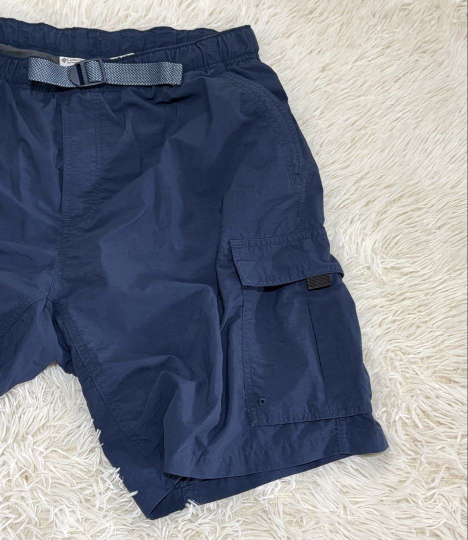 Columbia Navy Blue Cargo Shorts Size L (Category: Shorts) located in Manila. Submitted by calmstone_aaeaa3 (Listing ID 1460985439, Image 3). Description: - Navy blue Columbia cargo shorts - Elastic waistband with adjustable belt - Multiple pockets for storage - Zippered side pockets for secure storage - Ideal for outdoor activities and casual wear - Comfortable and practical design.