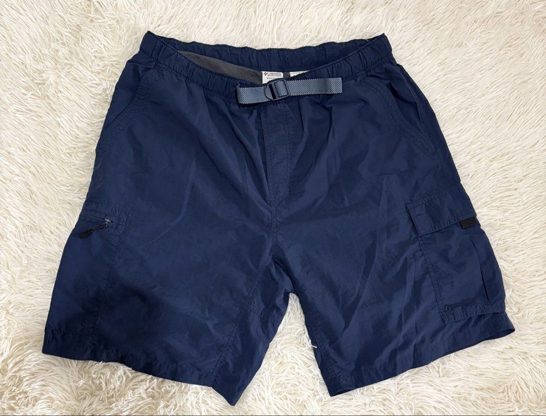 Columbia Navy Blue Cargo Shorts Size L (Category: Shorts) located in Manila. Submitted by calmstone_aaeaa3 (Listing ID 1460985439, Image 1). Description: - Navy blue Columbia cargo shorts - Elastic waistband with adjustable belt - Multiple pockets for storage - Zippered side pockets for secure storage - Ideal for outdoor activities and casual wear - Comfortable and practical design.