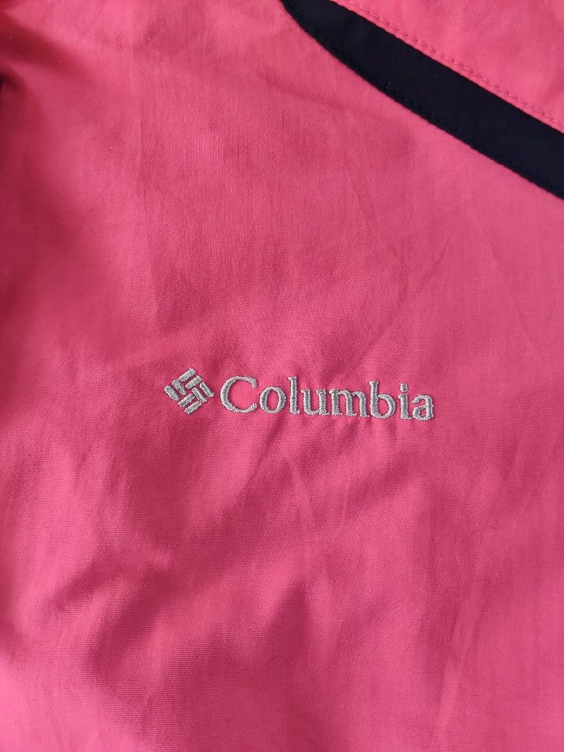 Columbia Pink Hooded Waterproof Jacket (Category: Coats, Jackets and Outerwear) located in Manila. Submitted by whatthethrift696 (Listing ID 1461063182, Image 3). Description: - Pink Columbia jacket with hood - Dark blue accents on shoulders and sleeves - Front zipper closure - Two front pockets - Adjustable cuffs - Ideal for rainy days and outdoor activities.