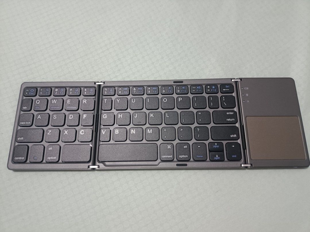 Compact Bluetooth Keyboard (Category: Computer Keyboard) located in Davao. Submitted by torisutan (Listing ID 1461042340, Image 1). Description: It's a bluetooth keyboard with an integrated trackpad. Its wireless Bluetooth is compatible with Windows, Android, and iOS devices..