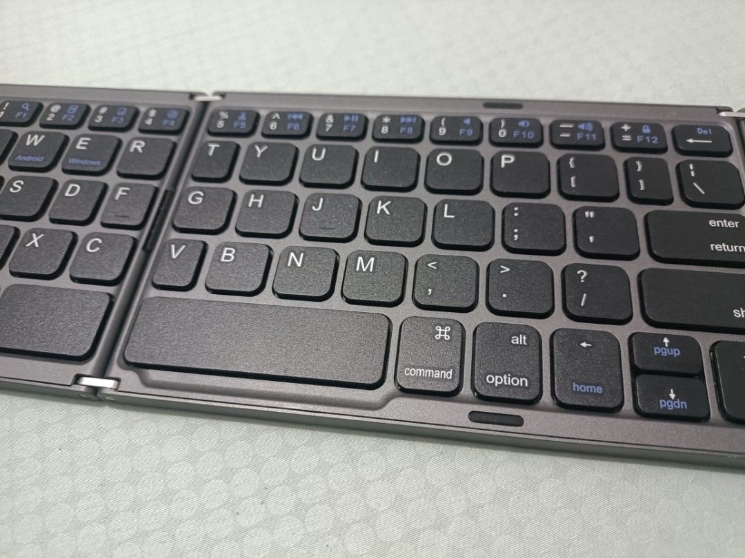 Compact Bluetooth Keyboard (Category: Computer Keyboard) located in Davao. Submitted by torisutan (Listing ID 1461042340, Image 2). Description: It's a bluetooth keyboard with an integrated trackpad. Its wireless Bluetooth is compatible with Windows, Android, and iOS devices..