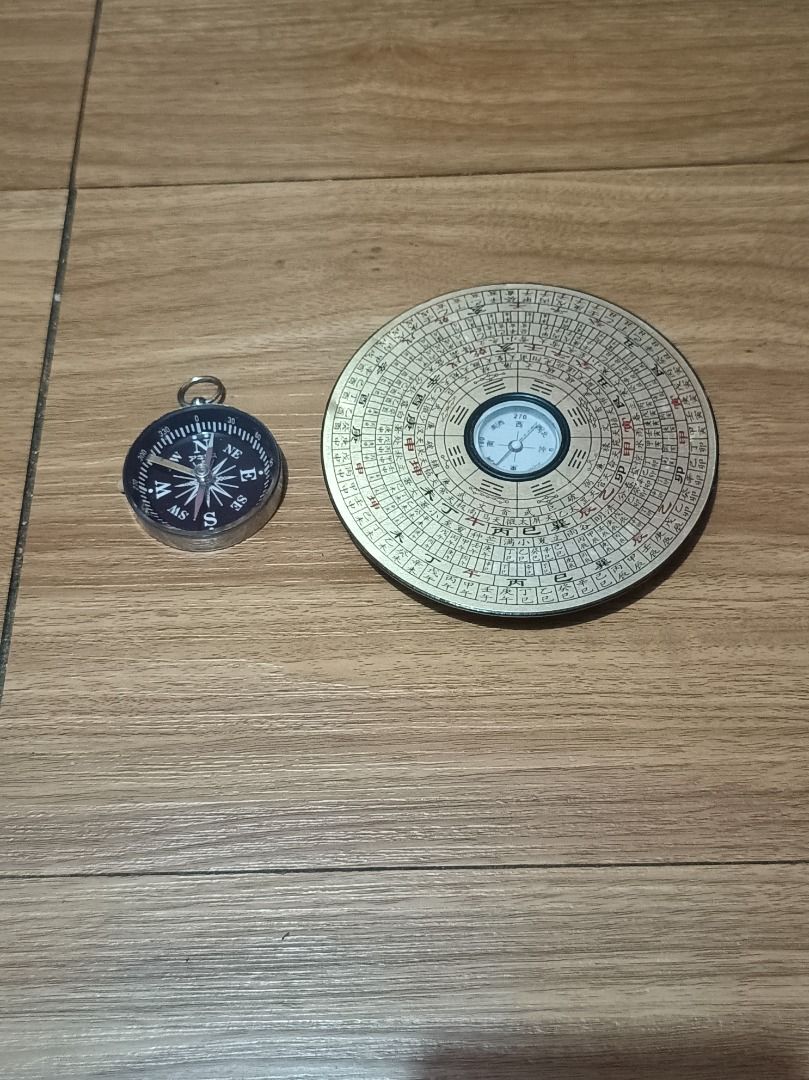Compass Bundle (Category: Vintage Collectibles) located in Makati City. Submitted by nyxhemera26 (Listing ID 1460990251, Image 1). Description: Compass Bundle - Pocket compass with metal casing and keychain loop. - Traditional gold-colored Chinese Feng Shui Luopan with intricate markings. - Both compasses are fully functional. - Ideal for collectors, navigation enthusiasts, or those interested in traditional practices. - Sold as a set..