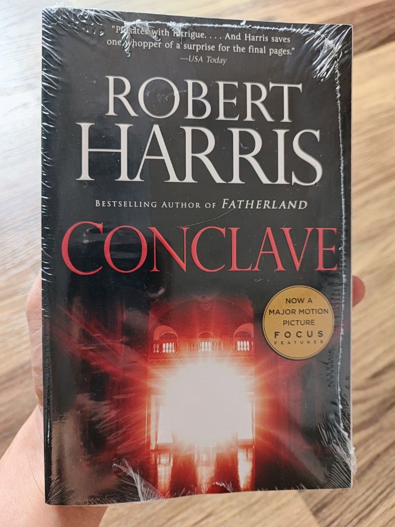 Conclave by Robert Harris - Now a Major Motion Picture (Category: Storybooks) located in Manila. Submitted by freestarbook (Listing ID 1460928235, Image 1). Description: - Sealed edition of Robert Harris's thriller, Conclave. - Story follows 118 cardinals electing a new pope after the current one dies. - Uncovers abuse and corruption within the Church. - A scandal that threatens to destroy them all. - Praised by USA Today as 'a page-turner with i