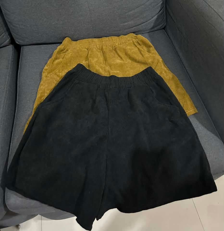 Corduroy Shorts Bundle (Black & Mustard) (Category: Shorts) located in Makati City. Submitted by mysticbear.f4fde2 (Listing ID 1461097516, Image 1). Description: - Bundle includes two corduroy shorts: one black, one mustard yellow. - Both shorts have comfortable elastic waistbands. - Functional pockets on both shorts. - Casual and comfortable style, ideal for everyday wear. - Great value bundle deal for both items..