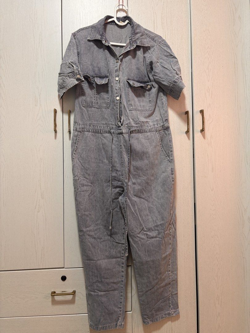 Cotton Denim Jumpsuit with Drawstring Waist (Category: Jumpsuits) located in Manila. Submitted by sophiadaphne (Listing ID 1460930991, Image 1). Description: - Stylish denim jumpsuit - Short sleeves with button detail - Adjustable drawstring waist for a perfect fit - Convenient chest and side pockets - Easy button-up front closure - Trendy frayed hem detail - Versatile for casual outings Shoulder to Hem: 53in Bust: up to 41in Waist: up to 37in.