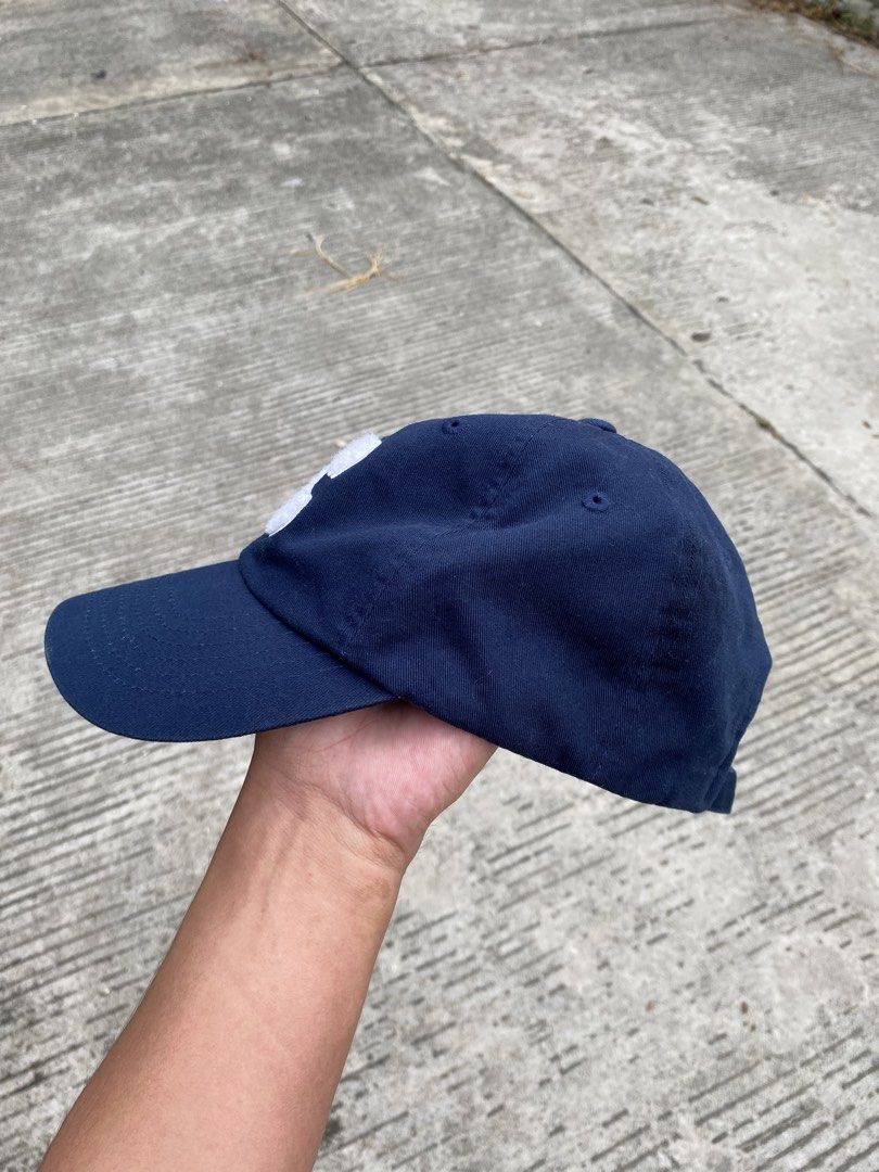 COVENANT Navy Blue Cap with White 'C' Logo (Category: Caps & Hats) located in Davao. Submitted by chazethrift (Listing ID 1461015767, Image 2). Description: - Navy blue cap from COVENANT - Features white embroidered 'C' on front and back - Adjustable strap for a comfortable fit - Classic, simple design perfect for everyday wear - Shows minimal signs of use.