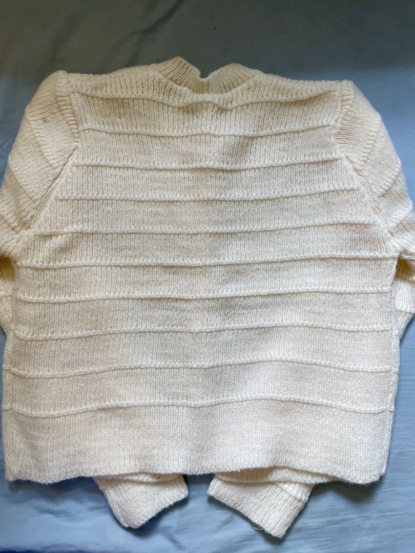Cream Knitted Button-Up Cardigan (Category: Coats, Jackets and Outerwear) located in Cavite. Submitted by ynahmo (Listing ID 1460971015, Image 3). Description: - Cream knitted cardigan - Textured horizontal stripe pattern - Round neckline - Pearl button closure down the front - Cozy and chic design - Ideal for layering.