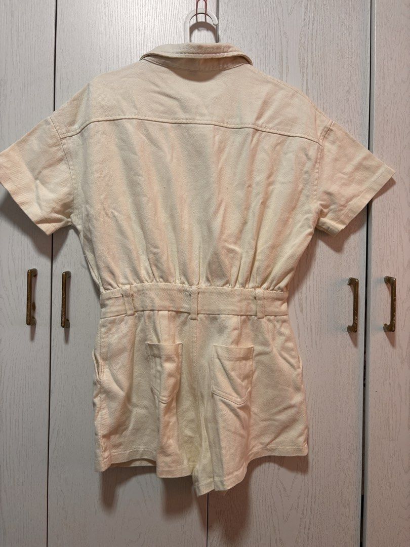 Cream Utility Playsuit with Belt loop (Category: Jumpsuits) located in Manila. Submitted by sophiadaphne (Listing ID 1460928546, Image 2). Description: - Cream colored utility playsuit - Short sleeves and collared neckline - Button-up front with belt loop - Two chest pockets and two back pockets - Soft denim fabric - Ideal for casual outings Shoulder to Hem: 28.5in Bust: up to 44in Waist: up to 28in.