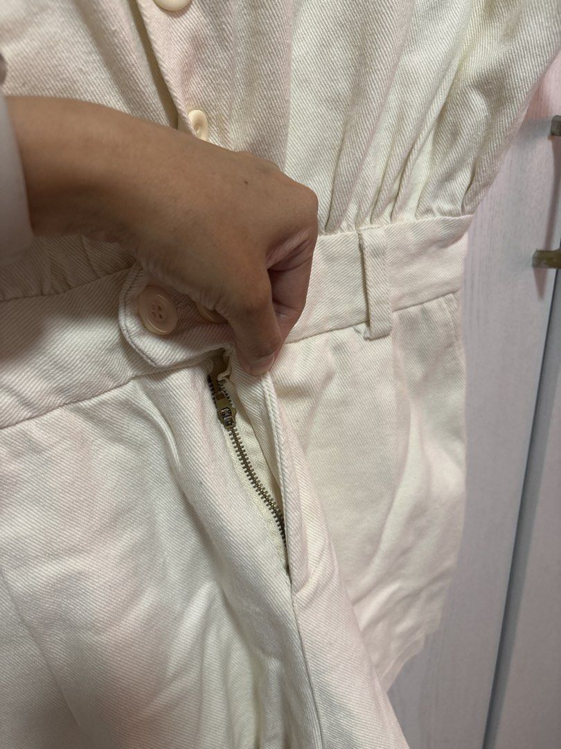 Cream Utility Playsuit with Belt loop (Category: Jumpsuits) located in Manila. Submitted by sophiadaphne (Listing ID 1460928546, Image 3). Description: - Cream colored utility playsuit - Short sleeves and collared neckline - Button-up front with belt loop - Two chest pockets and two back pockets - Soft denim fabric - Ideal for casual outings Shoulder to Hem: 28.5in Bust: up to 44in Waist: up to 28in.