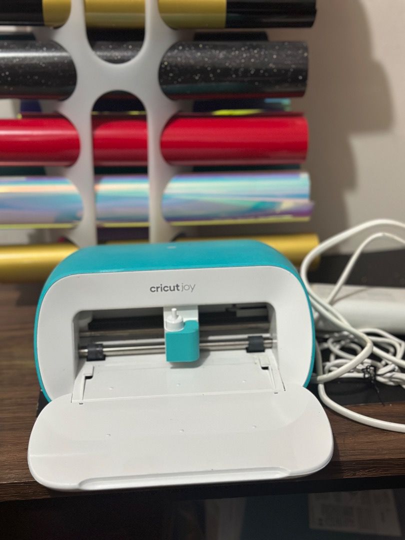 Cricut Joy Cutting Machine with Vinyl Rolls and Tools (Category: Craft Supplies & Tools) located in Cavite. Submitted by badqueen003 (Listing ID 1461029666, Image 1). Description: - Cricut Joy cutting machine - includes: Assorted vinyl rolls for crafts and HTV - Great for personalizing gifts, home decor, and DIY projects - Vinyl rolls are mostly full and unused - 15k total of products - plus tools set - with box.