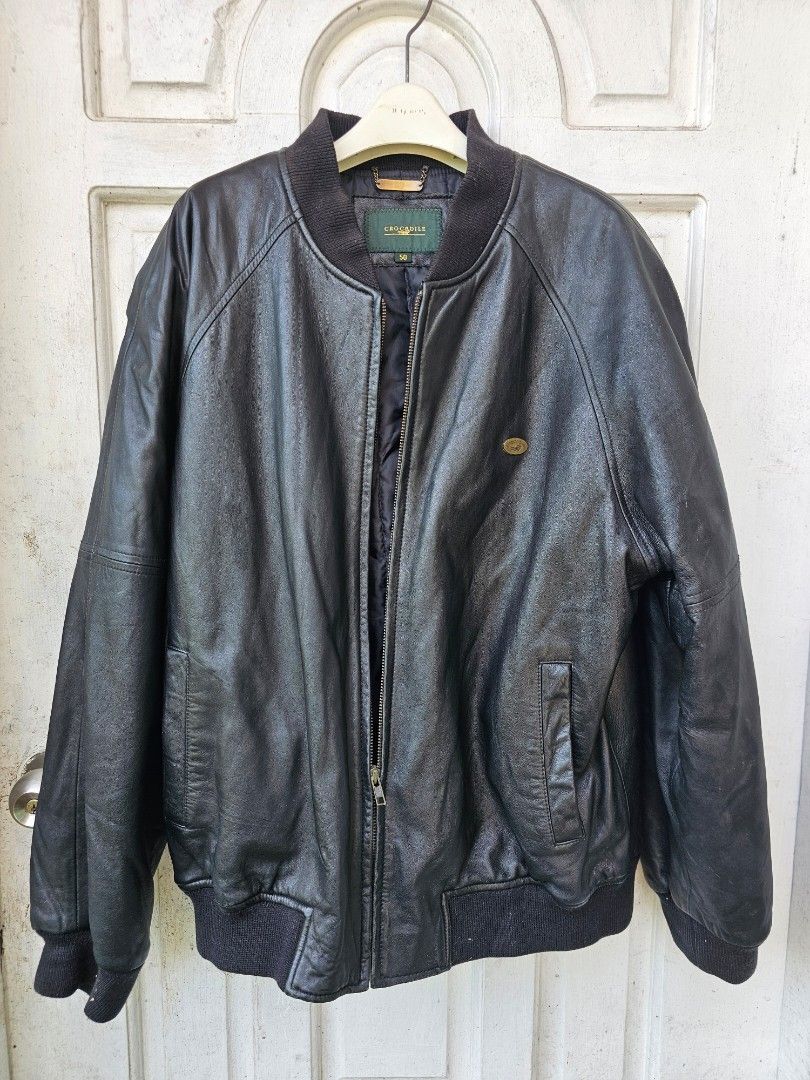 Crocodile Black Leather Bomber Jacket Size 50 (Category: Coats, Jackets and Outerwear) located in Tagbilaran City. Submitted by lugarpogi (Listing ID 1460960142, Image 2). Description: - Classic black leather bomber jacket - Brand: Crocodile - Material: Genuine Leather - Size: 50 - Features: Zip-up front, ribbed cuffs and hem, small embroidered logo on chest - Ideal for: Cooler weather - Condition: Please check photos for details.