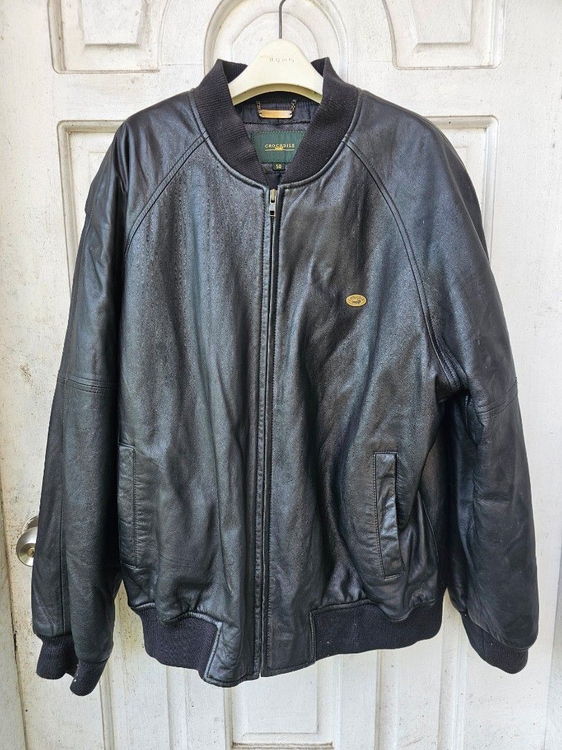 Crocodile Black Leather Bomber Jacket Size 50 (Category: Coats, Jackets and Outerwear) located in Tagbilaran City. Submitted by lugarpogi (Listing ID 1460960142, Image 1). Description: - Classic black leather bomber jacket - Brand: Crocodile - Material: Genuine Leather - Size: 50 - Features: Zip-up front, ribbed cuffs and hem, small embroidered logo on chest - Ideal for: Cooler weather - Condition: Please check photos for details.