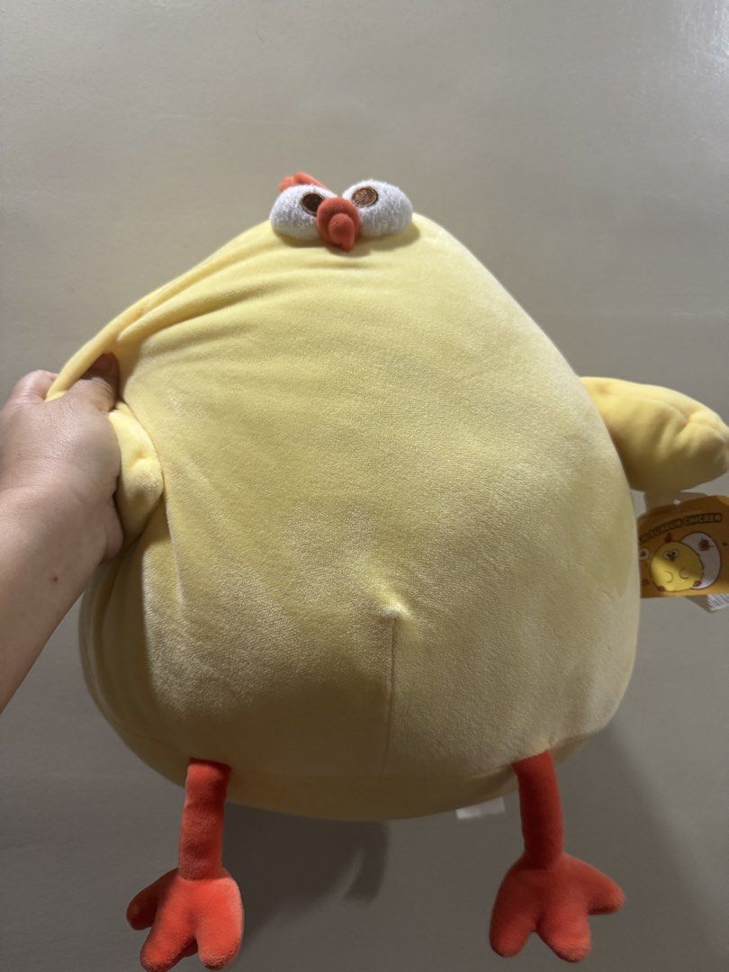 Curious Chicken Plush Toy (Category: Plushies & Soft Toys) located in Caloocan City. Submitted by xenasales (Listing ID 1461089800, Image 1). Description: - Adorable yellow chicken plush toy - Super soft and squishy, perfect for cuddling - Features big googly eyes and cute orange feet - Made with soft velvety material - Ideal as a gift or a fun room decoration - Tag reads 'Curious Chicken'.