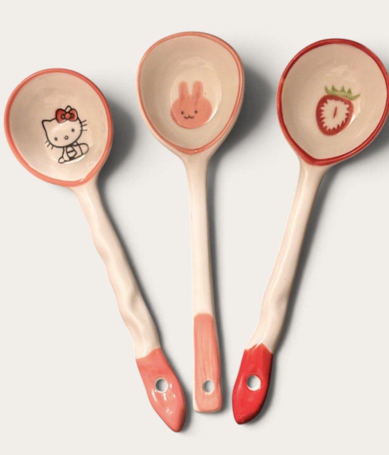 Cute Ceramic Spoons - Hello Kitty, Bunny, Strawberry Designs (Category: Dinnerware & Cutlery) located in Bacoor. Submitted by dangeusebio1515 (Listing ID 1460989242, Image 1). Description: - Set of 3 adorable ceramic spoons - Features Hello Kitty, pink bunny face, and strawberry designs - Pink or red glazed edges and handles - Adds a cute touch to your kitchenware - Makes a great gift idea - Each spoon has a hole for hanging.