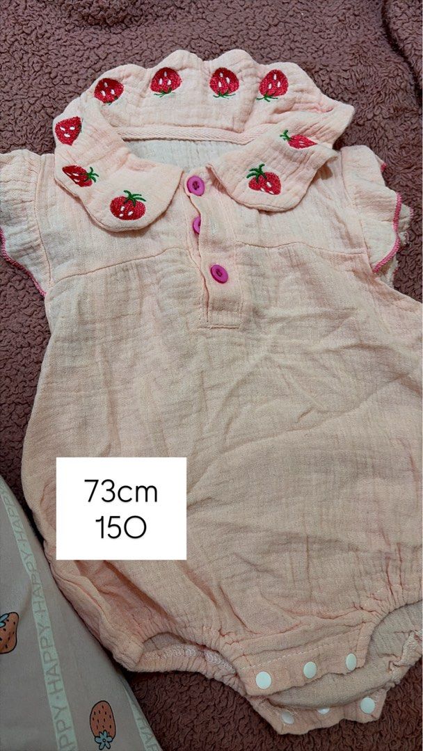 Cute Strawberry Romper 73cm (Category: Babies & Kids Fashion) located in General Trias. Submitted by scoutpringles (Listing ID 1460964454, Image 1). Description: - Adorable pink romper with sweet strawberry embroidery. - Classic Peter Pan collar and convenient button front. - Short sleeves with charming ruffled trim. - Easy snap closure at the bottom for quick diaper changes. - Lightweight and breathable fabric, perfect for summer. - Ideal additi