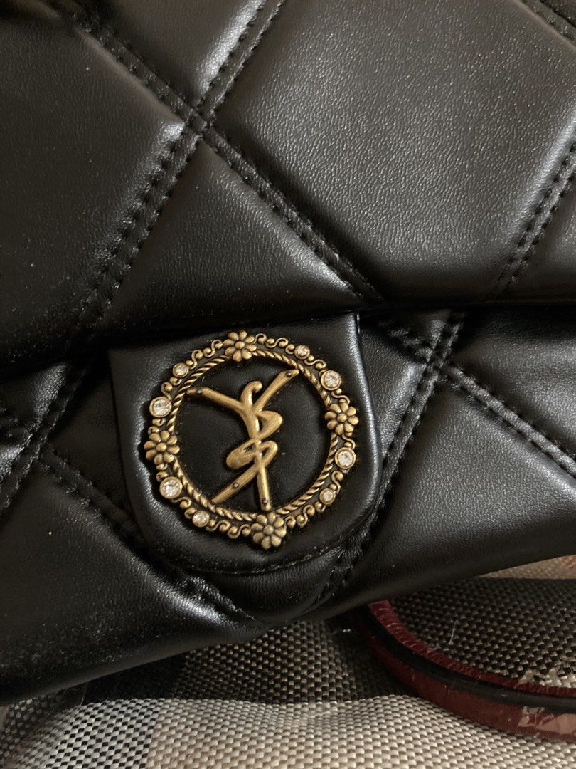 CUWLEA Black Quilted Chain Shoulder Bag (Category: Luxury Bags & Wallets) located in Manila. Submitted by abengjoy30 (Listing ID 1461070289, Image 3). Description: - Elegant black quilted shoulder bag - Features a luxurious gold chain strap - Adorned with a decorative emblem on the front flap - 'CUWLEA' branded zippers for a touch of exclusivity - Ample interior space with convenient zippered compartments.