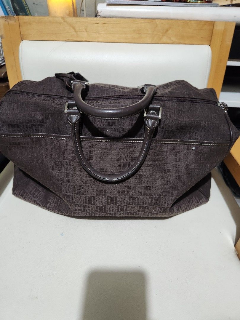 Daks London Brown Monogram Duffel Bag (Category: Luxury Bags & Wallets) located in Quezon City. Submitted by amber___18 (Listing ID 1461083739, Image 2). Description: - Authentic Brown Daks London duffel bag - Features iconic Daks monogram pattern all over - Genuine leather handles and trim for a premium feel - Secure zipper closure - Interior zippered pocket for essentials - Spacious enough for weekend trips or gym use 40 cm length 27 height 20 