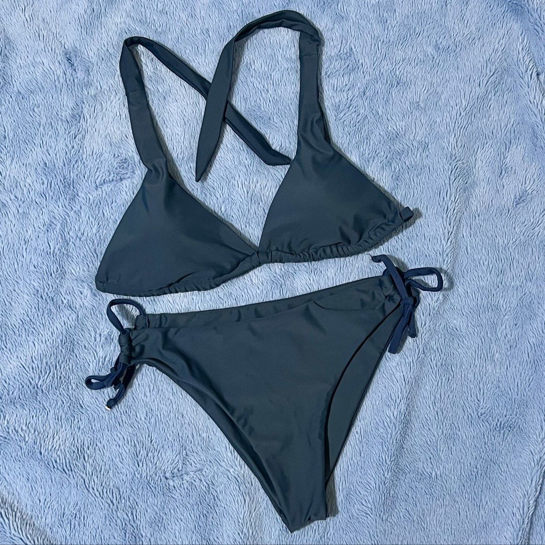 Dark Grey Halter Neck Triangle Bikini Set (Category: Bikinis & Swimsuits) located in Cebu City. Submitted by zjm.c (Listing ID 1461053512, Image 1). Description: - Dark grey bikini set - Halter neck top with tie closure - Triangle cup style - Bottoms feature adjustable tie sides - Ideal for beach or pool outings - Comfortable and stylish design.