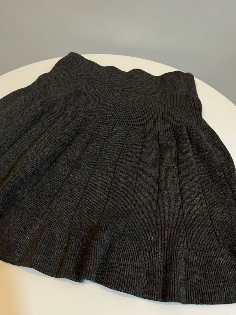 Dark Grey Pleated Knit Mini Skirt (Category: Skirts) located in Manila. Submitted by xoshushi.dcltr (Listing ID 1460975603, Image 2). Description: - Dark grey knit skirt - Pleated design all around - Ribbed and stretchy waistband - Mini skirt length - Easy to pair with various tops for different looks.