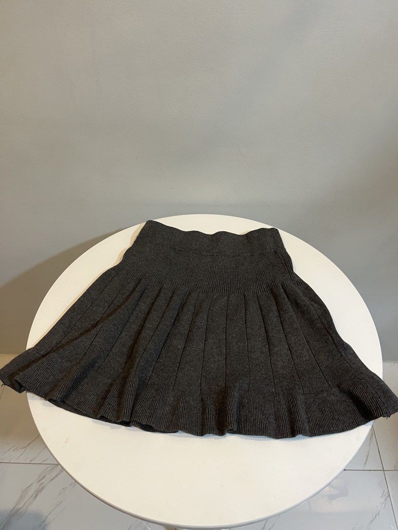 Dark Grey Pleated Knit Mini Skirt (Category: Skirts) located in Manila. Submitted by xoshushi.dcltr (Listing ID 1460975603, Image 1). Description: - Dark grey knit skirt - Pleated design all around - Ribbed and stretchy waistband - Mini skirt length - Easy to pair with various tops for different looks.