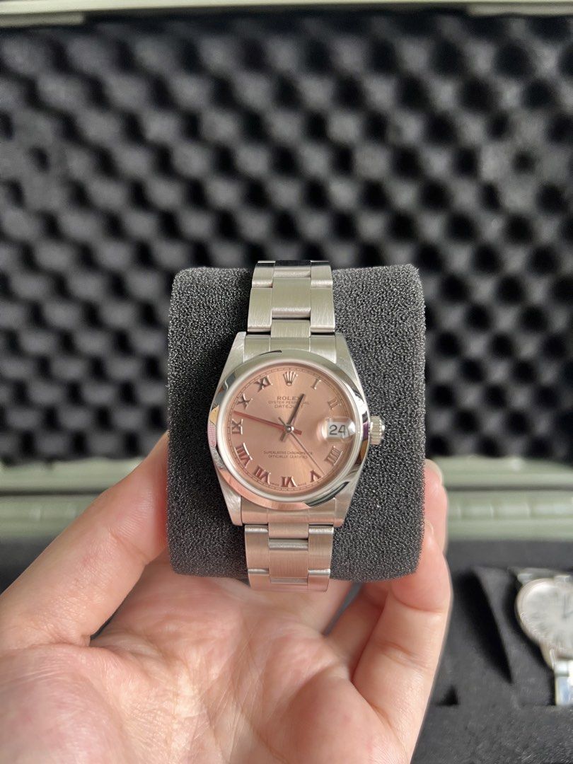 Datejust salmon pink dial 31mm (Category: Women's Watches) located in Paranaque City. Submitted by ella.sb (Listing ID 1461032709, Image 1). Description: Full set. Complete links. Box, papers, manuals, and red tag. (the numerical numbers is white gold) .